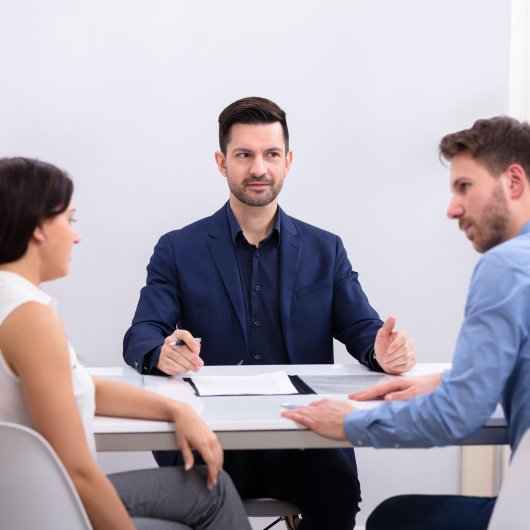 A mediator conducting a mediation session with a couple going through a separation.
